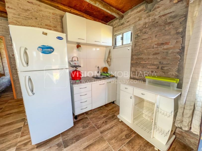 Venta conjunta de Dos Casas independientes en un gran terreno de 622 m2, una de 2 Dormitorios y 1 Baño, la otra de 1 Dormitorio y 1 Baño, Parrillero, Garaje. Barrio Español del balneario Atlántida, 8 cuadras al Norte de la Interbalnearia por Ruta 11.-48