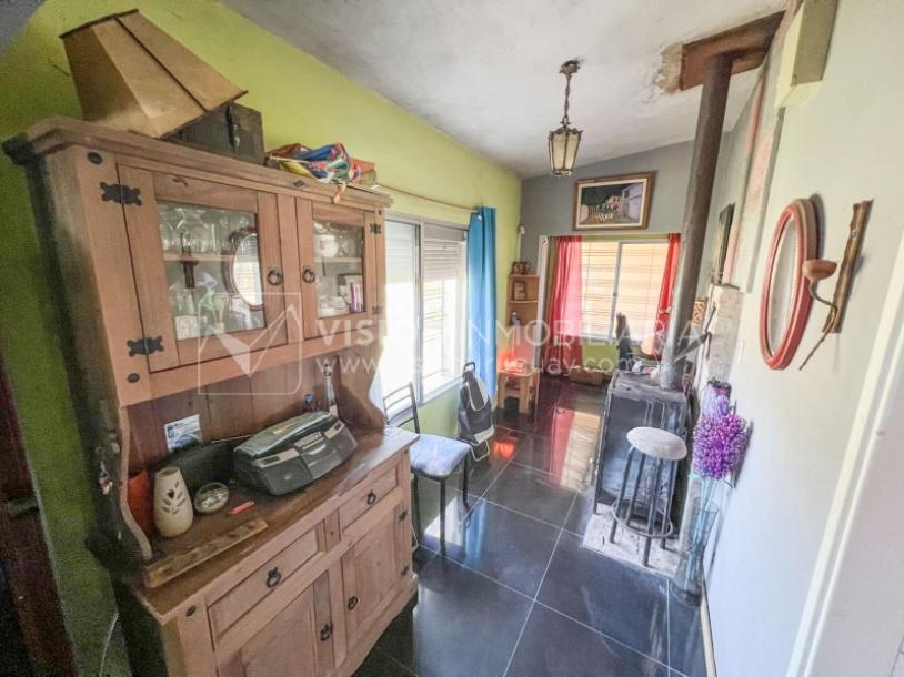 Venta conjunta de Dos Casas independientes en un gran terreno de 622 m2, una de 2 Dormitorios y 1 Baño, la otra de 1 Dormitorio y 1 Baño, Parrillero, Garaje. Barrio Español del balneario Atlántida, 8 cuadras al Norte de la Interbalnearia por Ruta 11.-24