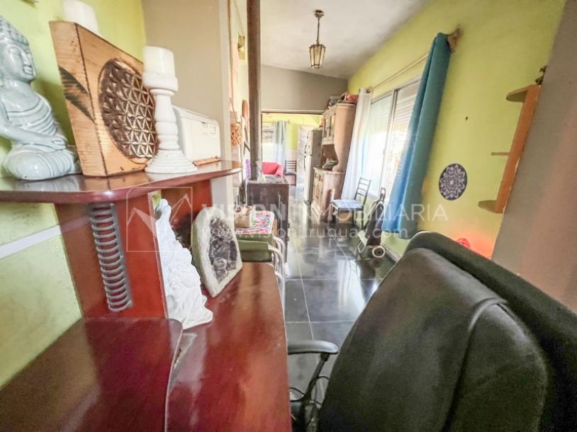 Venta conjunta de Dos Casas independientes en un gran terreno de 622 m2, una de 2 Dormitorios y 1 Baño, la otra de 1 Dormitorio y 1 Baño, Parrillero, Garaje. Barrio Español del balneario Atlántida, 8 cuadras al Norte de la Interbalnearia por Ruta 11.-27