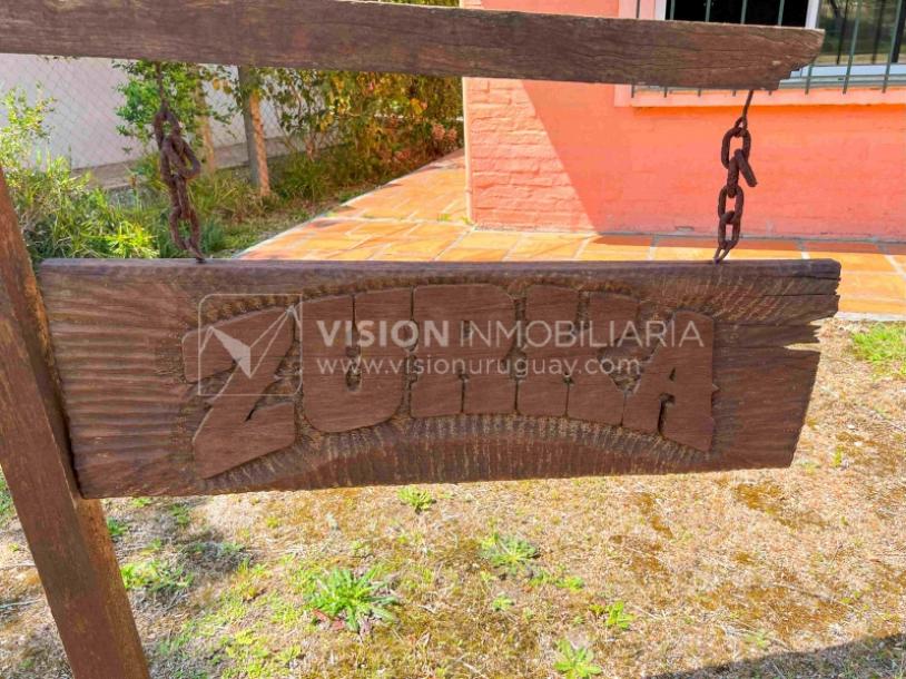 Venta de Casa en Santa Lucia del Este: 2 Dorm. y Baño, más Apto. 1 Dorm. y Baño. Estufa a Leña, Parrillero, Jardín, Fondo, Cochera Porsche, Cerco. 554 m2 de Terreno, 125 m2 construidos. a 150 mts de la Rambla. Se vende Totalmente Amueblada y Equipada-11